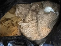 BAG OF MATERIAL OR CLOTHES LACY DOILY
