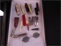Pocket knives, blue-tint vintage spectacles,