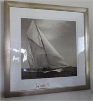 Framed black and white photo of sailboat at sea