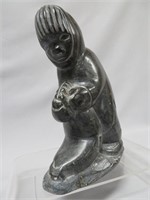 Inuit soapstone carving, man with seal, 7" high