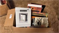 Box lot of picture frames, photo albums, and more