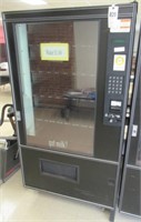 Coil style vending machine. Measures 72.5" H x