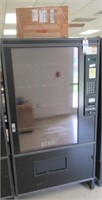 Coil style vending machine. Measures 72.75" H x