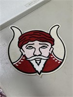 Patch of a guy in a red hat