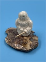 Walrus Ivory carving of a native man on a fossiliz