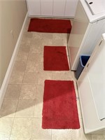 Red Rugs in Basement Laundry Room