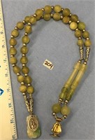 18" green stone necklace with "Infant of Prague" o