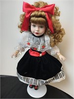 Collectible on a pedestal Doll Porcelain with a