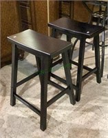 Matching pair of wooden saddle style barstools
