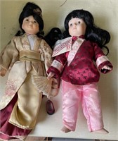 2 Oriental porcelain dolls