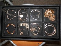 Jewelry-divided tray of 14 bracelets