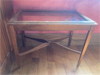Oblong side table with glass top