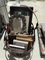 Collection of frames in metal basket