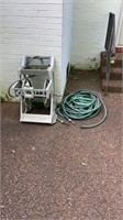 2 water hoses and water hose reel