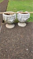 2 matching medium concrete planters