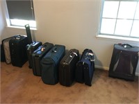 Assorted suit cases luggage