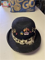 Old hat with decorative pins