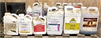 (12) partial plastic jugs of Ag chemicals,