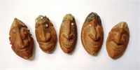 Set five Pacific carved nut wood heads