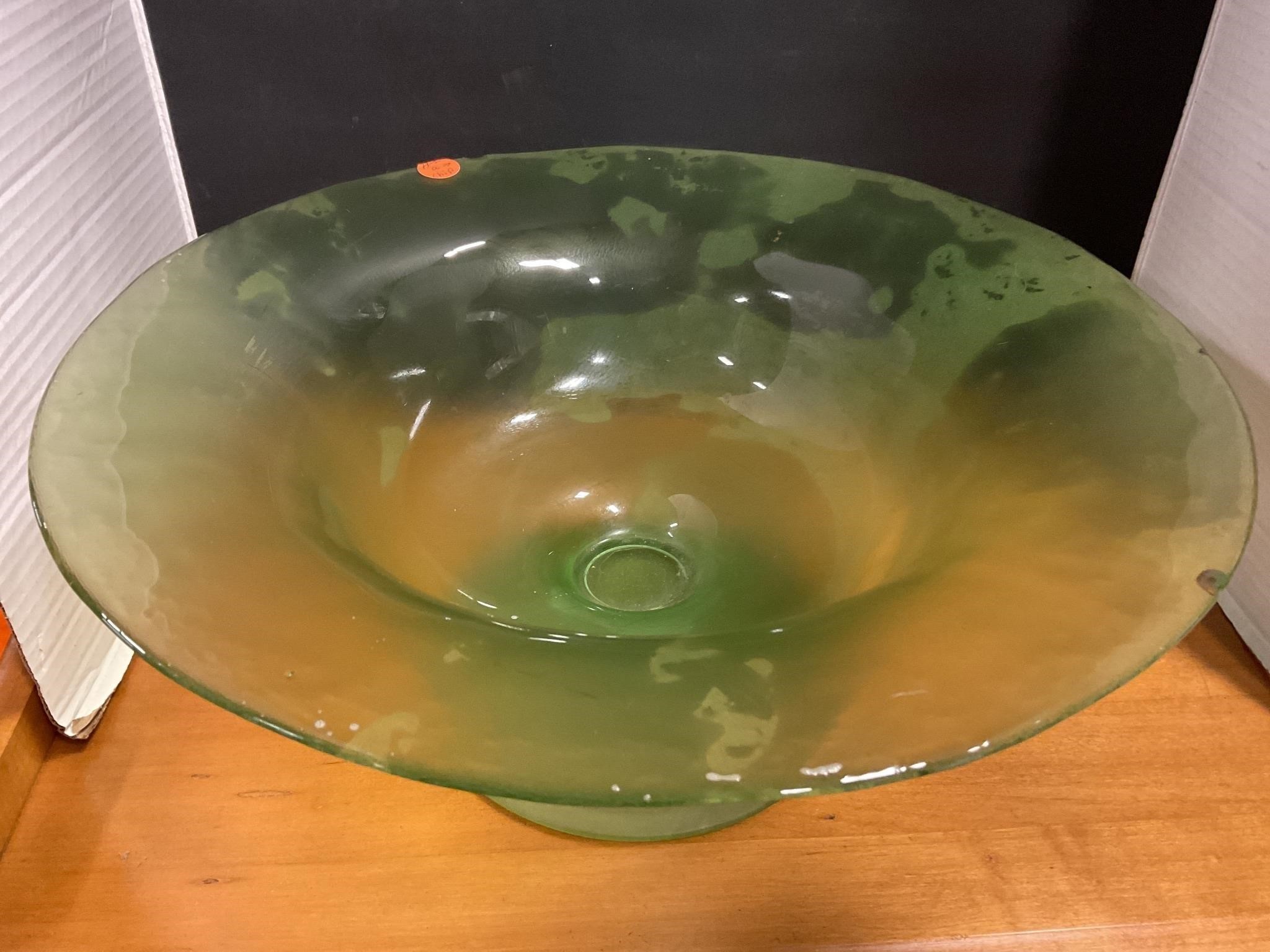 Large green bowl has a chip
