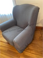 Burgundy chair has a gray cover that's easily