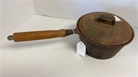Cast iron sauce pan w/ wood handle
