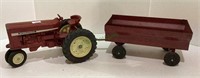 Vintage tractor with wagon. Tractor is measuring