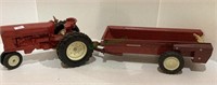 Die cast International tractor with hay wagon.