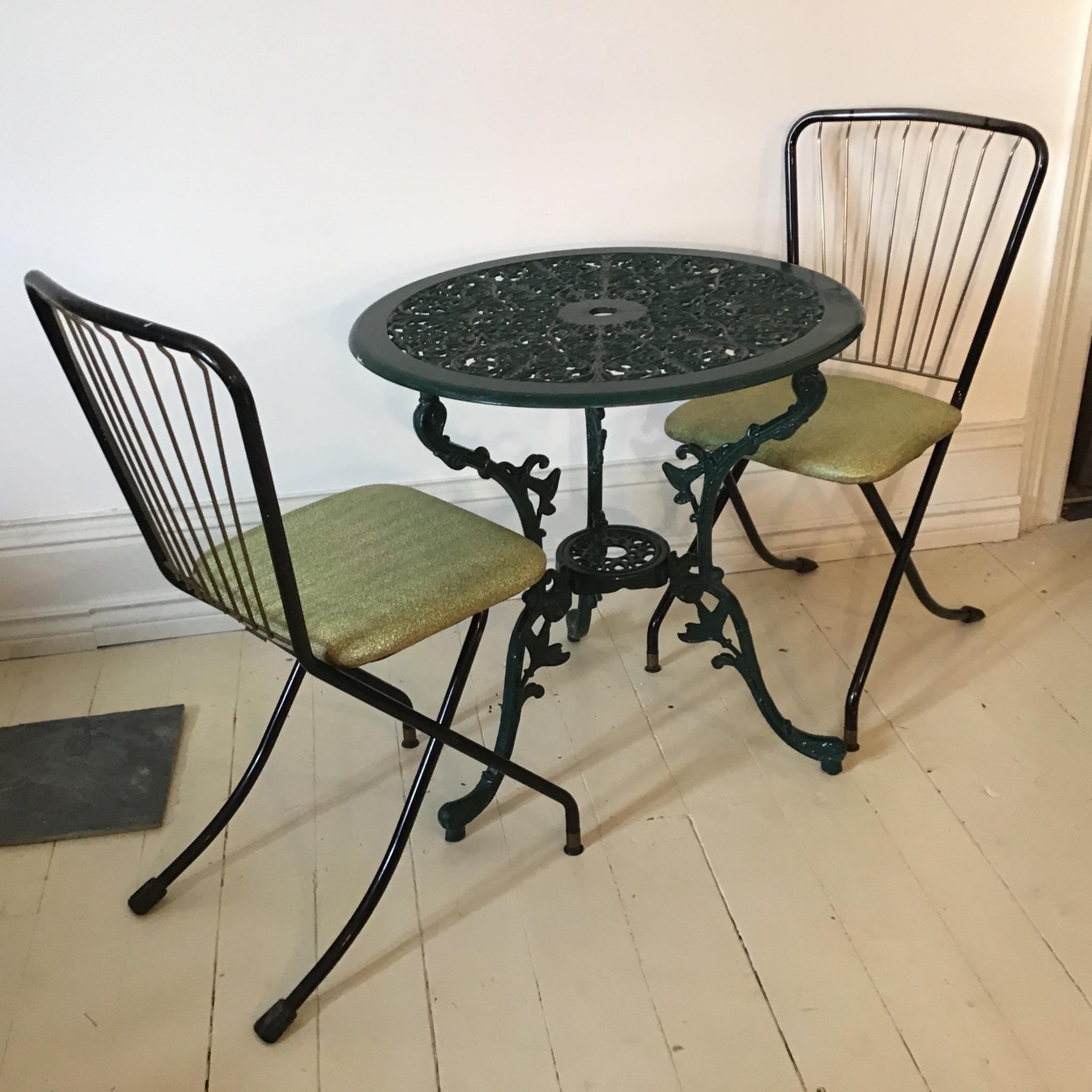 CAST IRON FOLDING CHAIRS AND BISTRO TABLE