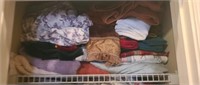 Estate shelf of towels, blankets, ect
