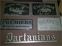Five metal motorcycle club and car club signs.