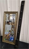 Framed 22.5 x 10.5 in mirror with wood wall