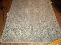 Tan colored area rug 60inx90in