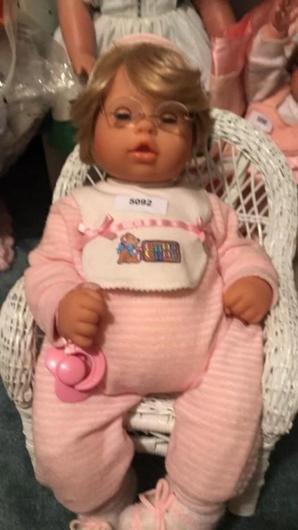 Baby w glasses in chair