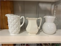 3 white glass pitchers