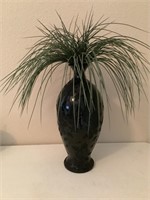 Black ceramic vase with faux floral arrangement
