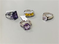 4 sterling rings w/ colored stones - 1 is amythest