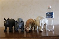 4 rhino figurines