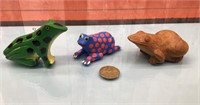 Carved wood frogs