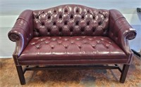 TUFFTED LEATHER UPHOLSTERED LOVE SEAT