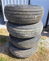 Four 11L-15SL implement Tires on rims