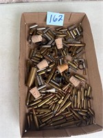 Various rifle bullets and brass casings
