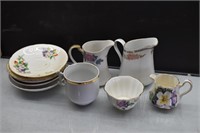 Assortment of China Saucers, Creamers, cup, etc