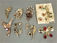 8 vintage Deco sterling silver brooches set with