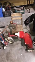 One Radio Flyer red trike kids bicycle, with some
