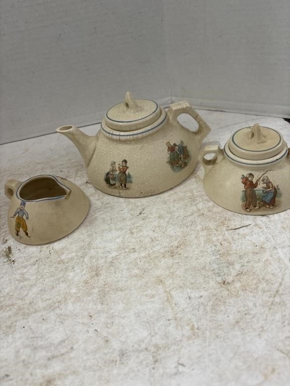 Flat with Antique Roseville Pottery Tea Pot Set