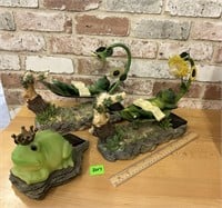 2 lounging frog solar lights and