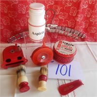 Red thermometer, hangers, tin container