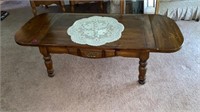 Wooden coffee table with fold down leaves 54x22