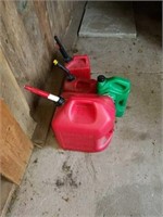 Lot of 3 gas cans, and oil (half full).